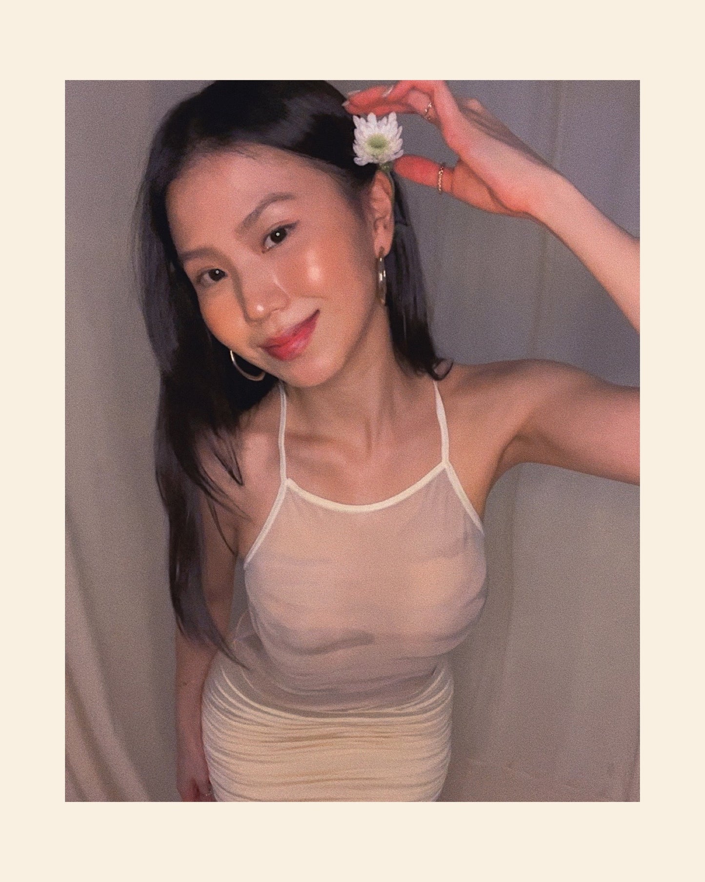 Ivory sleeveless maxi dress with printed mesh upper body panel with thin straps crossed at back and mermaid-cut draped lower part.